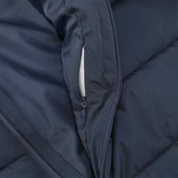A navy blue puffer jacket featuring a zippered pocket and a soft interior lining. The fabric showcases a quilted texture.
