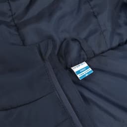 A navy puffer jacket featuring a tag. The fabric appears smooth with a stitched pattern.