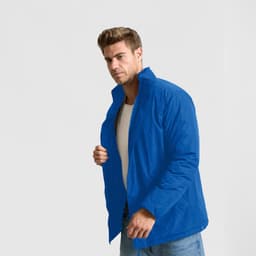 A puffer jacket in bright blue, worn by a man with a casual stance. It features a collar and a zippered front.