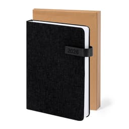 A black diary with a textured cover, featuring a band, displayed with a kraft paper box behind it.