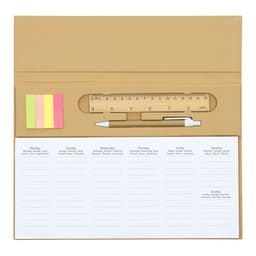 A tan planner pad featuring a ruler, a pen, and sticky notes in pink and yellow, with weekly planning sections.