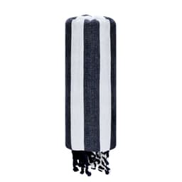 A striped bath towel in navy blue and white with tasselled edges, featuring a logo.