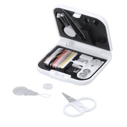 A compact sewing kit with assorted threads, buttons, needles, safety pins, and small scissors in a white case.
