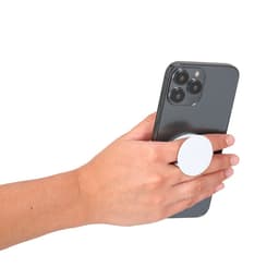 A hand holding a black smartphone with a white phone stand attachment on the back.