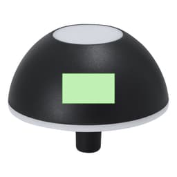 A black dome-shaped lamp with a white top and a green accent area, featuring a small base.