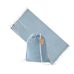 A blue drawstring bag with a matching beach towel, featuring a logo and fringed edges.
