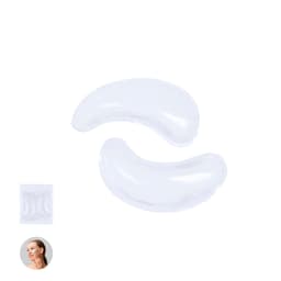 Two transparent eye patches in a curved shape, packaged alongside an image of a person applying them.