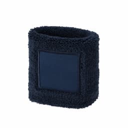 A navy blue wristband made of soft, textured fabric with a plain patch for branding.