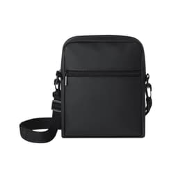 A small black bag with a front zip pocket, an adjustable strap, and a simple design. It has a logo.
