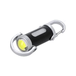 A black and silver torch with a yellow light and a carabiner clip for easy attachment.
