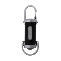 A black torch with a silver clip, featuring a central light panel and a round base, designed for keyring attachment.