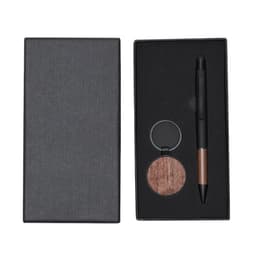 A metal pen with a wooden accent and a round wooden keychain, presented in a sleek black gift box.