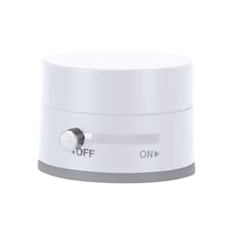 A white and grey device with a round shape, featuring an on/off switch and a metallic knob.