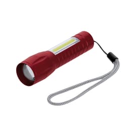 A red torch with a textured grip and a wrist strap, featuring a bright white LED light.