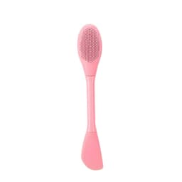 A pink dual-ended beauty tool featuring a textured applicator on one end and a smooth spatula on the other.