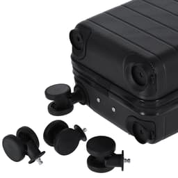 A black wheeled bag with replaceable wheels displayed beside it. The bag features a textured surface.