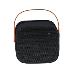 A black Bluetooth speaker with a brown handle and mesh speaker grill. It features a compact, square design.