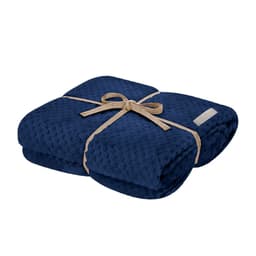A folded navy blue blanket tied with a natural twine ribbon, featuring a small logo on one side.