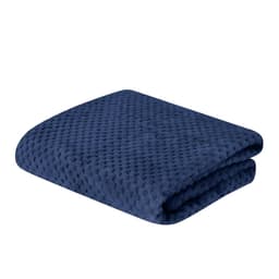 A navy blue Iridian Blanket with a textured surface, neatly folded. It features a logo.