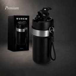 A drink bottle in matte black with a silver band, featuring a removable lid and a carrying strap, beside its packaging.