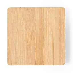 A square bamboo coaster with a smooth, natural finish and rounded corners. Ideal for beverages or decorative use.