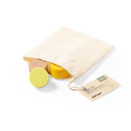 Three solid shampoo bars in different colours inside a natural fabric pouch, accompanied by a tag.