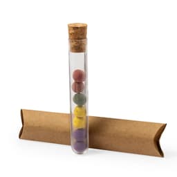 A glass test tube with a cork stopper containing coloured chocolate balls. Accompanied by a brown cardboard holder.