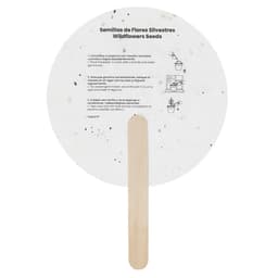 A circular seed paper with a wooden stick, featuring speckles and instructions for planting wildflower seeds.
