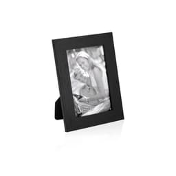 A black photo frame with a portrait of a couple smiling inside. The frame is freestanding with a simple design.