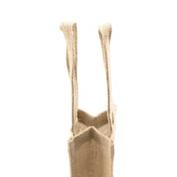 A beige burlap bag with two handles and an open top, featuring a simple design and sturdy material.