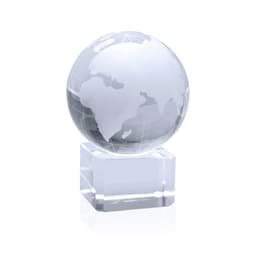 A clear crystal globe displayed on a transparent base, featuring outlines of continents.