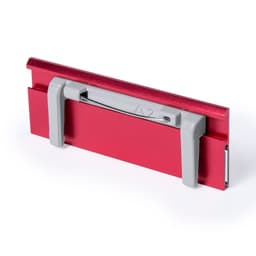 A red name badge holder with grey clips, designed for exhibitions and events, featuring a branding logo.