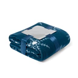 A folded teal blanket featuring a patterned design, secured with a satin ribbon and a logo label.