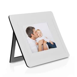 A white photo frame with a black border, displaying a picture of a man holding a baby.