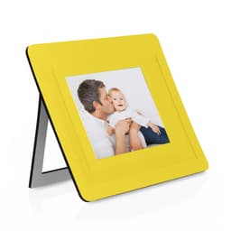 A yellow photo frame with a centrally placed picture, featuring a man and a child, stands on a black base.