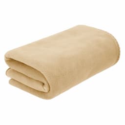 A folded beige blanket made of soft fabric, featuring a stitched edge and a branding logo.