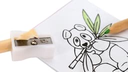 A coloured pencil with a sharpener attached, next to a sheet of paper featuring a panda illustration.