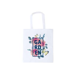 A white tote bag featuring floral designs and a decorative "GARDEN" graphic, with handles for easy carrying.