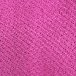 A textured pink towel featuring a woven pattern, suitable for gym and outdoor activities. It has a logo in one corner.