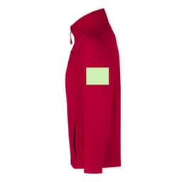 A red soft shell jacket featuring a logo on the sleeve and a green label patch.