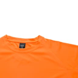 An orange T-shirt with a round neck, featuring a logo on the label.