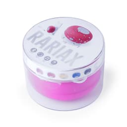 A pink speaker packaged in a clear container, featuring a circular design and a logo on the lid.