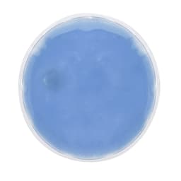 A round heat pack in a clear pouch, filled with a light blue gel. It has a simple design and no visible branding.