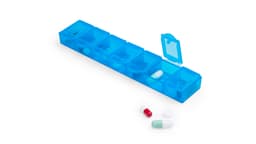 A blue pillbox with multiple compartments, containing various capsules and tablets, including red, white, and green pills.