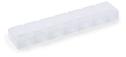 A clear plastic pillbox with multiple compartments for organising medications. It has a sleek, streamlined design.