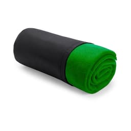 A rolled blanket featuring a vibrant green interior and a black exterior, neatly secured for storage.