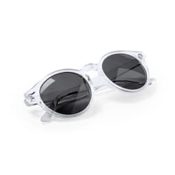 A pair of clear-framed sunglasses with dark lenses, featuring a rounded design and a logo on the arm.