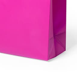 A pink bag with a glossy finish and a flat base, featuring a branded logo.