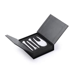 A golf accessory set in a black box, featuring white tees and a divot tool. Contains five items.