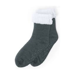 A pair of dark grey socks with a fluffy white cuff and non-slip dots on the soles. The product has branding.